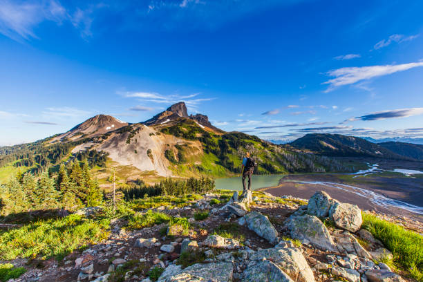 istock Young man taking in a breathtaking view after hiking to the summit 1497943797