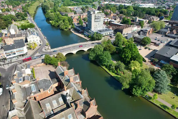 Aerial Footage of Historical Bedford City of England During Sunny Day of May 27th, 2023. The Footage Captured with Drone's Camera from Medium High Altitude over the City and River Ouse and Station.