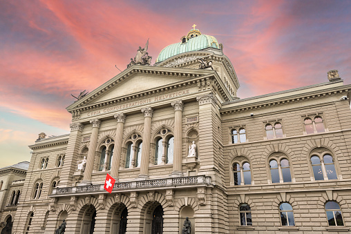 Riverside of Rhine in Basel dominated by majestic building of Munster church, Switzerland