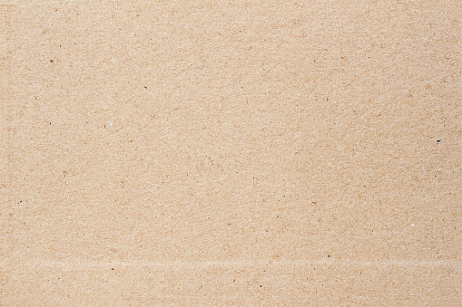 Kraft paper, cardboard with strip close-up. Surface texture of old paper
