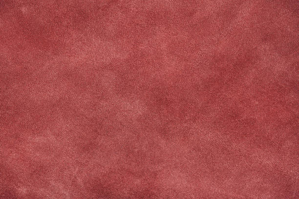 istock Texture of dark red suede, matte background. Fabric, leather, material, accessories manufacturing 1497946294
