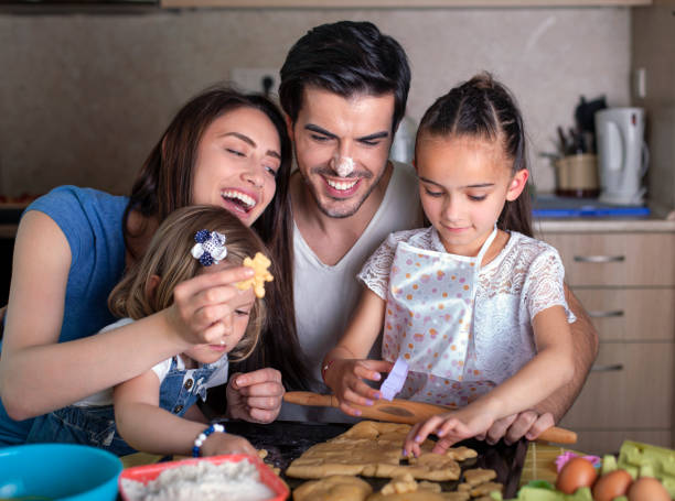 istock Happy family baking cookies 1497947195