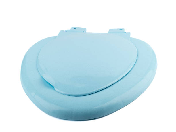 istock Blue toilet seat with a closed lid on a white background. 1497948933