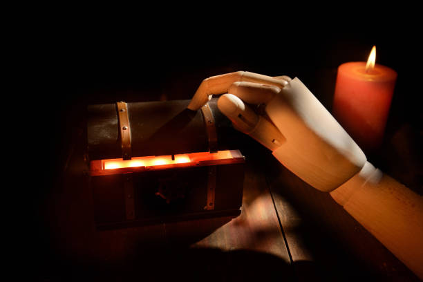 istock Treasure Chest - Open Ancient Trunk With Glowing Magic Lights In The Dark 1497950707