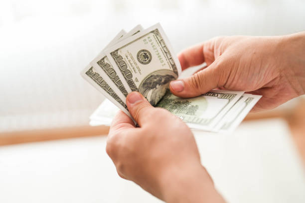 istock counting money getting american dollars 1497953574