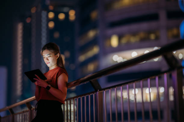 istock Illuminated Connections: An Asian Woman's Exploration of Humanizing Digital Experiences in the City 1497954975