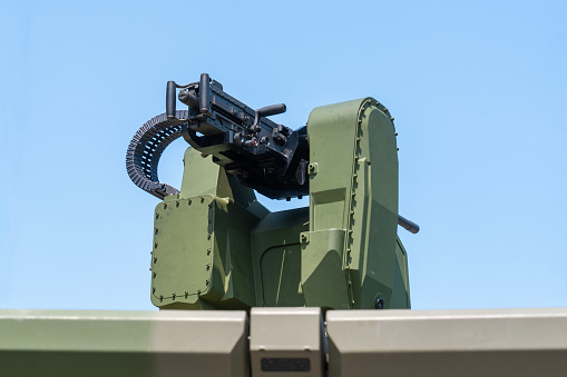 .50 cal, M2 Browning, heavy, machine gun, on top, green camouflage, colored, armored vehicle