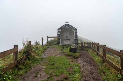 Small chapel in the fog over the caldera on Faial island, Azores