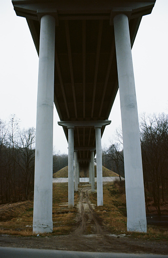 View from beneath the bridge under the highway. Film photography