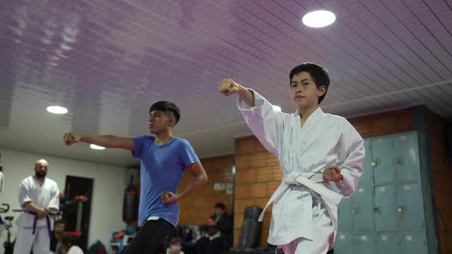 Children practicing karate during a karate class