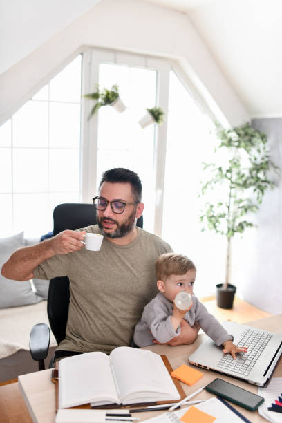 istock Baby Son Helps Journalist Father In Office 1497972862