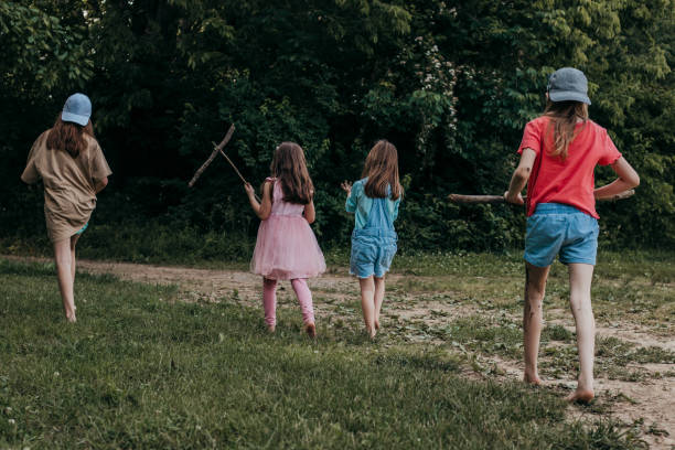 istock Children hike in nature while attending activities at a summer camp 1497975690
