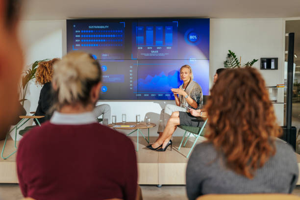 istock Businesswoman talking about strategy on conference stage. 1497975742