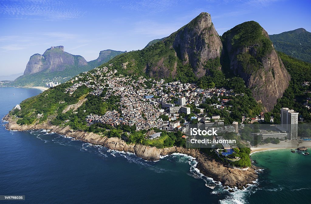 Vidigal Favela in Rio de Janeiro Pedra da Gavea and Sao Conrado Beach (left) and Two Brothers Mountain at the top of the favela Vidigal Beach Stock Photo