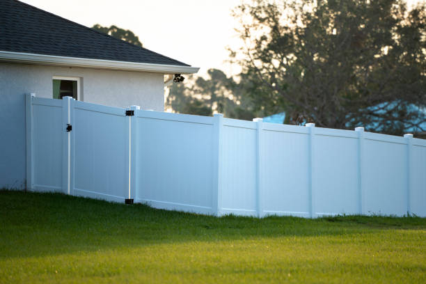 istock White plastic fence for back yard protection and privacy 1497989044
