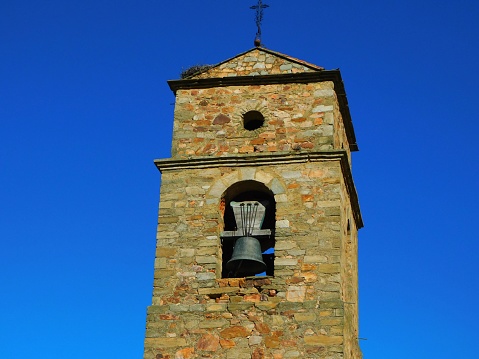 The church bell of a small church by lake of Bracciano photographed on an early winter morning
