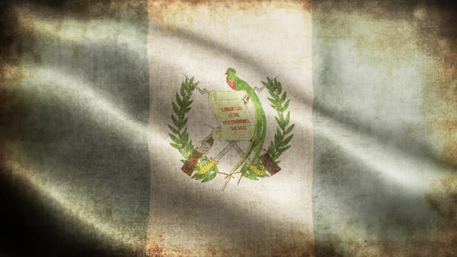 Closeup of grunge Guatemala waving flag loopable stock video