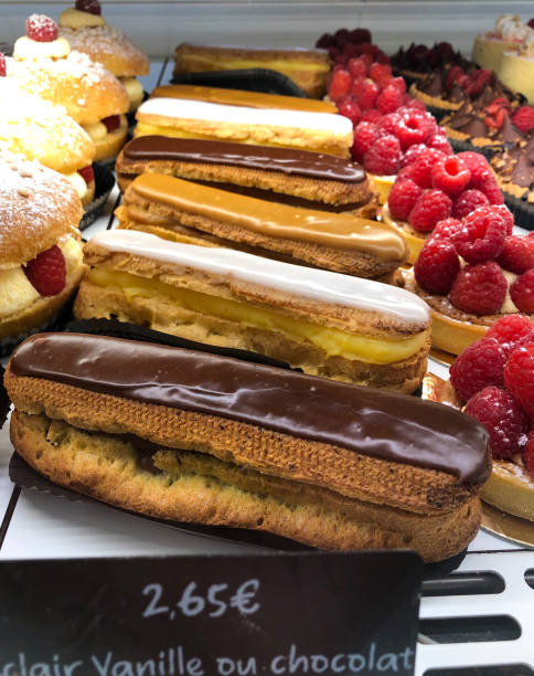 istock France: Gorgeous Eclairs and Raspberry Tarts in Patisserie Case 1497992098