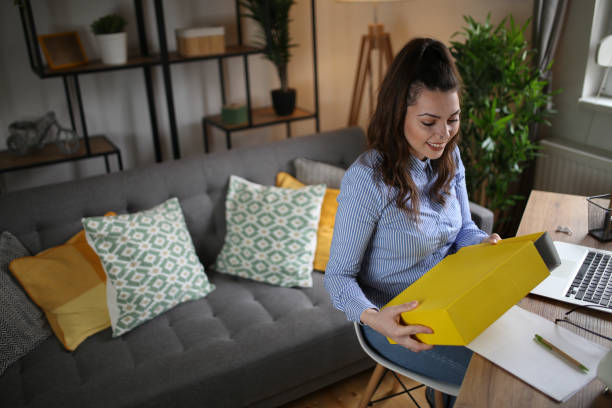 istock Woman analyzing documents while sitting at home stock photo 1497992240