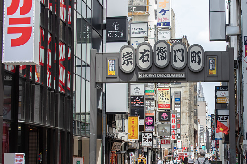 Osaka, Japan - August 19, 2022 : The billboards on the Dotonbori Canal in Osaka, Japan. Dotonbori is often selected as a scene in the Japanese movies as the symbol of Osaka.