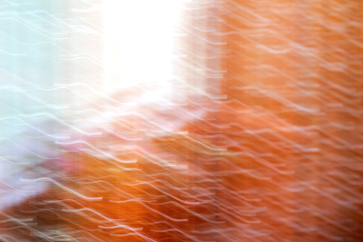 Abstract motion blur background. Orange light. Blurred hallucinations psychedelic design. Out of focus.