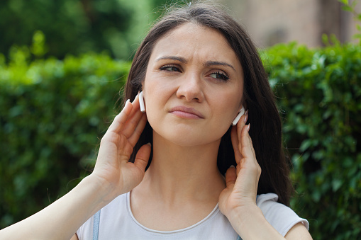 Young woman having hearing loss