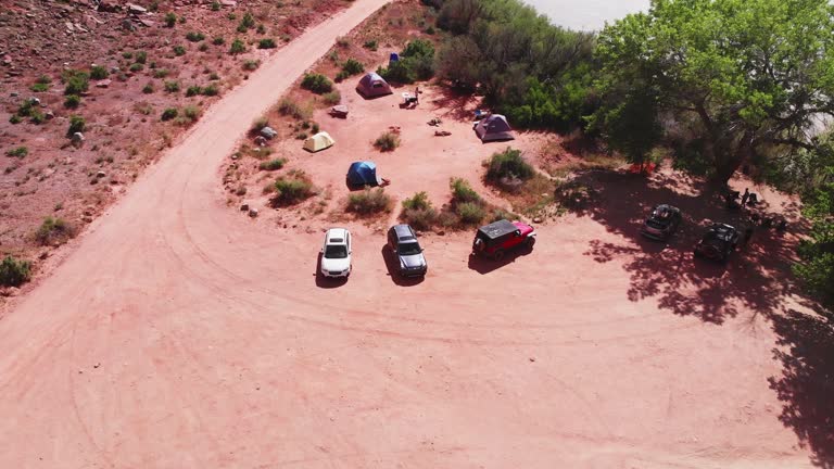 An aerial perspective unveils the breathtaking beauty of Mineral Canyon, a hidden gem near Dead Horse Point, Utah. The flowing Green River winds through the majestic canyon, leading the eye towards the distant allure of Canyonlands National Park.