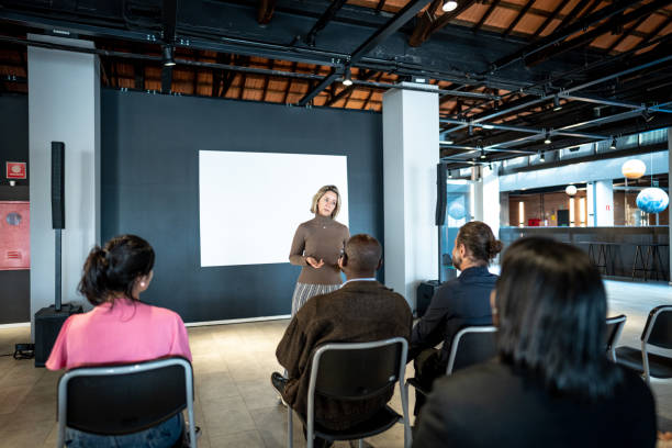 istock Mature woman making a presentation in a seminar 1497998768