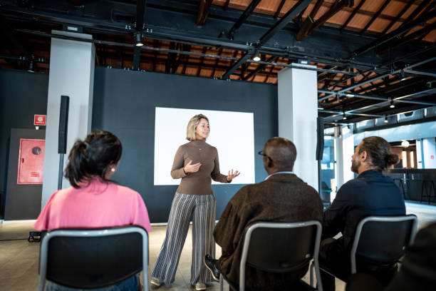istock Mature woman making a presentation in a seminar 1497998769