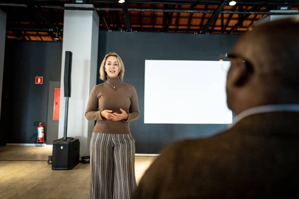 Mature woman making a presentation in a seminar