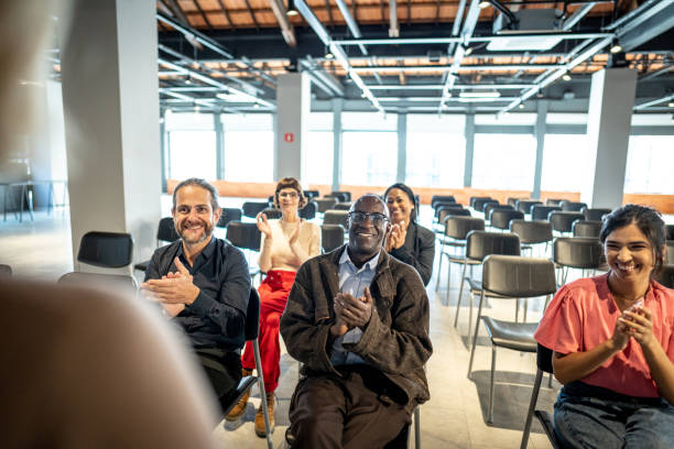 istock Group of people clapping in a seminar 1497998778