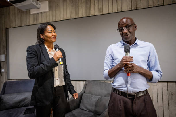 istock Mature woman interviewing a man in a seminar 1497998833