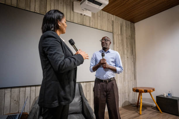 istock Mature woman interviewing a man in a seminar 1497998834
