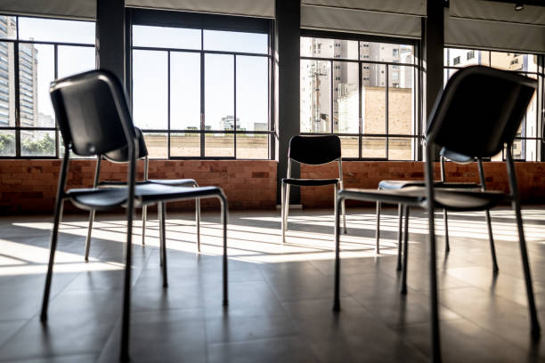 istock Chairs at group therapy without people 1498000150