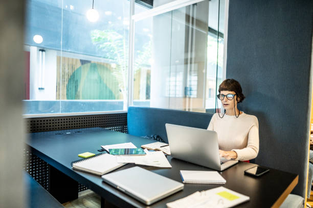 istock Mature businesswoman working using laptop at office/coworking 1498005221