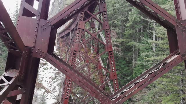 High, old and rusty metal bridge. Change Creek Trestle on the Snoqualmie Valley