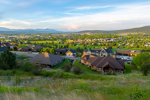 The city of Liberty Lake, Washington USA and the Liberty Lake golf course with cities of Newman Lake and Rathdrum and Post Falls Idaho behind, viewed from a hilltop suburb of Spokane Washington.