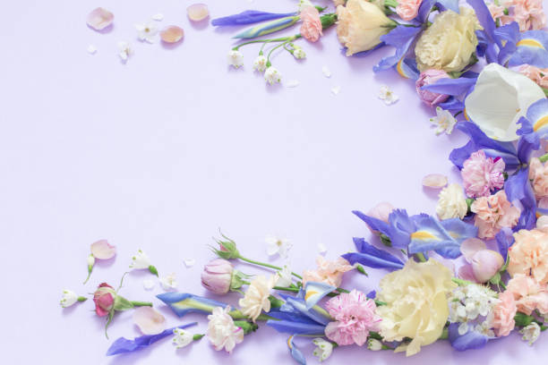 istock beautiful spring flowers on paper background 1498012056
