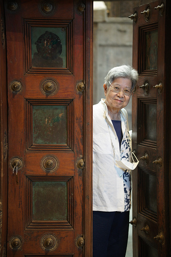 asian old elderly elder senior woman smiling at door