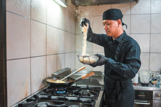 istock Young Chef's Skills in the Asian Kitchen 1498026246