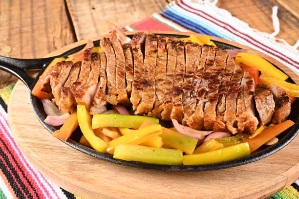 istock roasted meat with vegetables, barbecue with herb sauces, grilled steak 1498032123