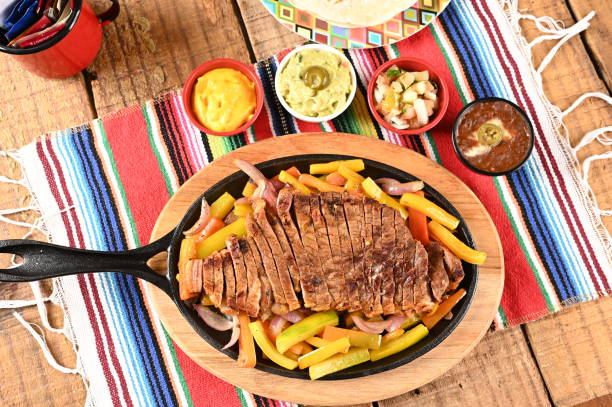 istock roasted meat with vegetables, barbecue with herb sauces, grilled steak 1498032133