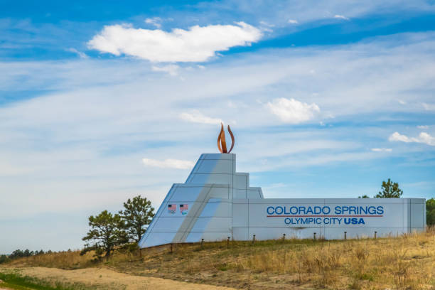 An entrance road going to the campus of Colorado Springs, Colorado Colorado Springs, CO - May 06, 2022: The Olympic City USA colorado springs city stock pictures, royalty-free photos & images
