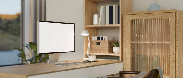 istock A minimalist Scandinavian home workspace with computer mockup on a wooden table 1498036631