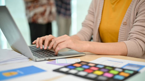 istock A professional Asian female graphic designer is working on her work on her laptop 1498038837