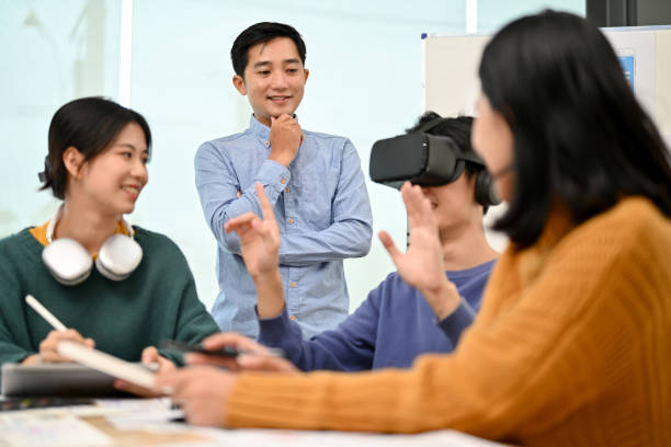 istock A male developer sitting at the table tested a new VR game with virtual reality goggles 1498038918