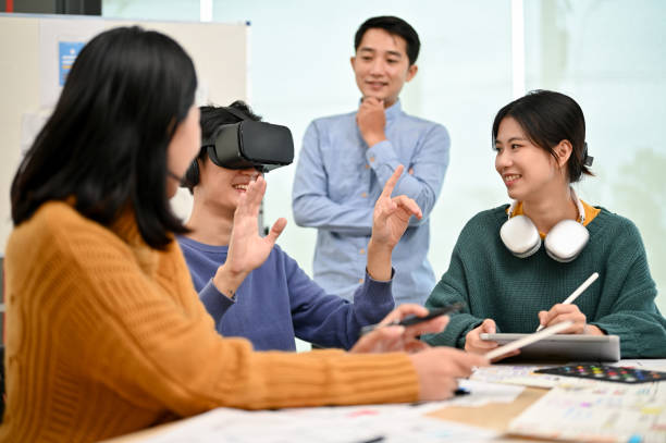 istock An excited Asian male developer tested a new virtual reality headset with his team 1498038928