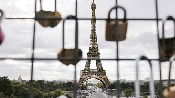 istock The Eiffel Tower in Paris on a cloudy day 1498039868