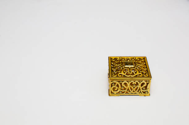 istock Golden gift box on white background with copy space space. 1498041536
