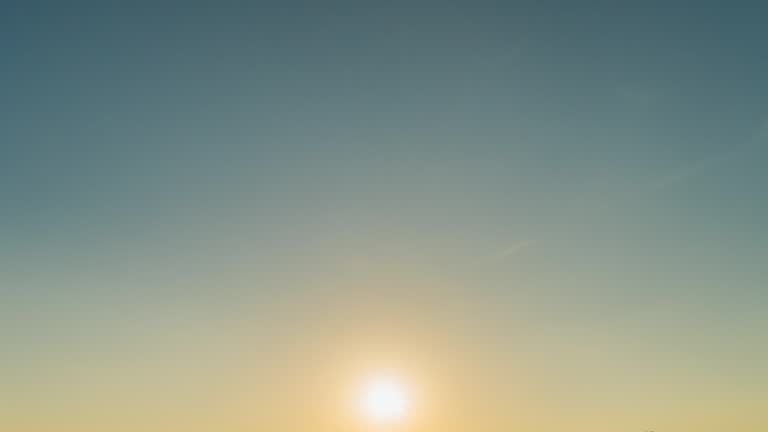 Sky and clouds moving with sunrise 4K Time lapse.